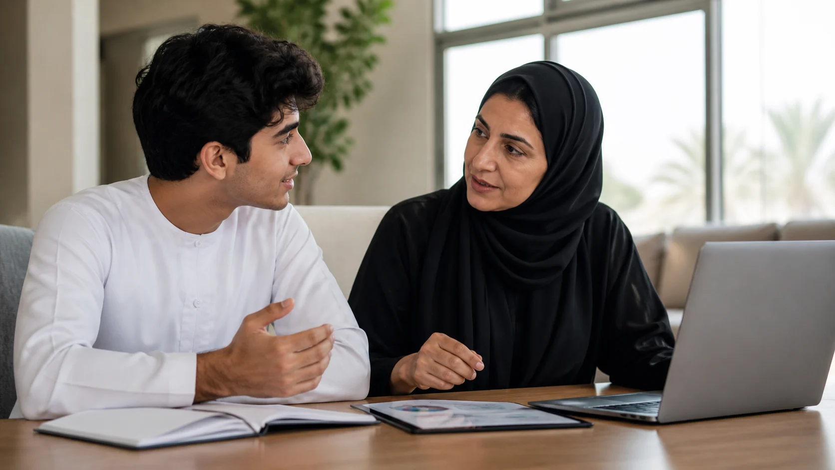 Student and parent planning an education budget with scholarship options in mind.