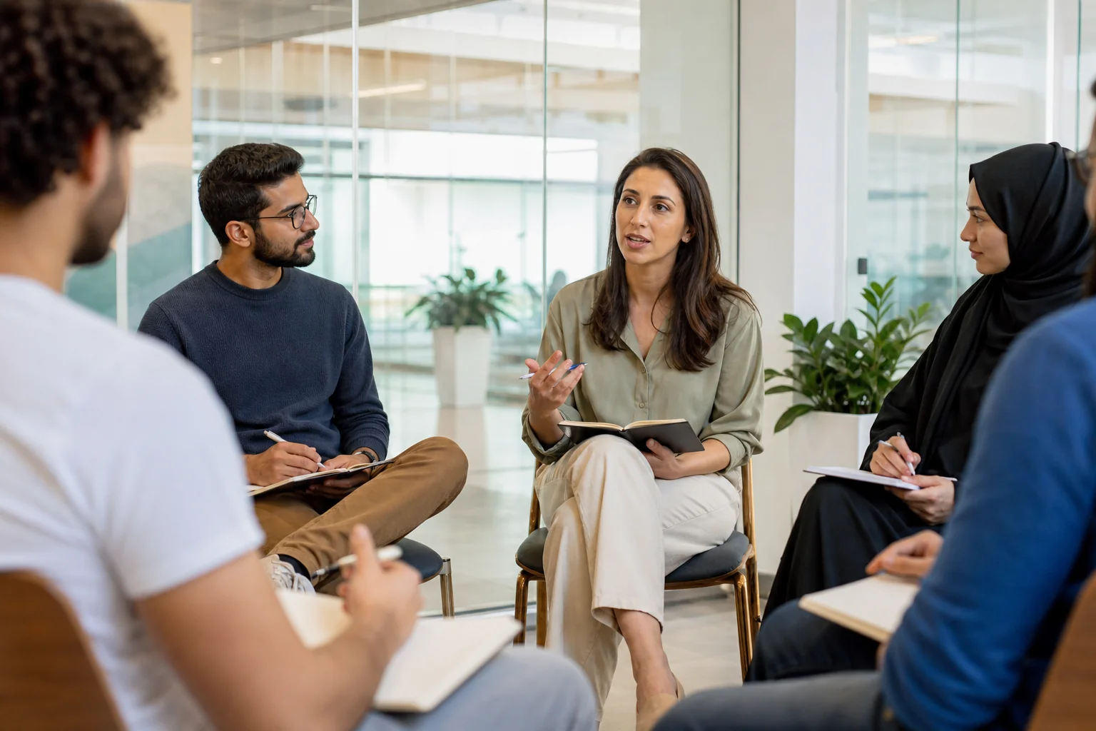 Students listening to a facilitator at a psychology seminar