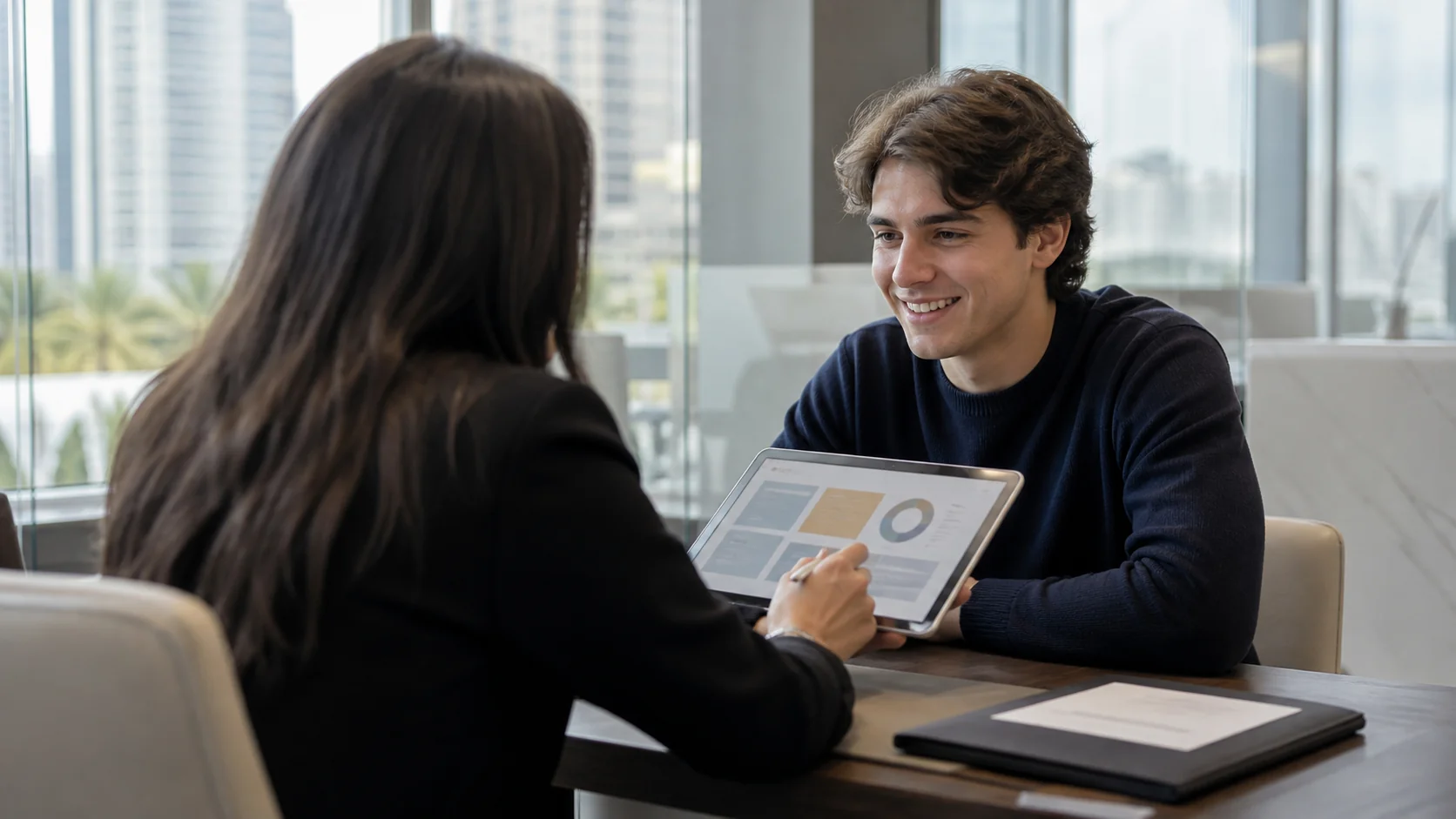 Student speaking with a financial adviser in an office